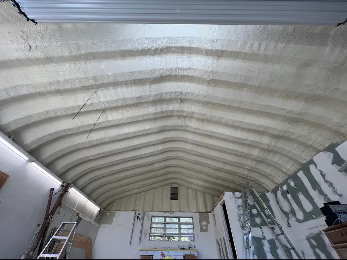 Spray polyurethane foam applied to the underside of a metal roof deck in Wakefield